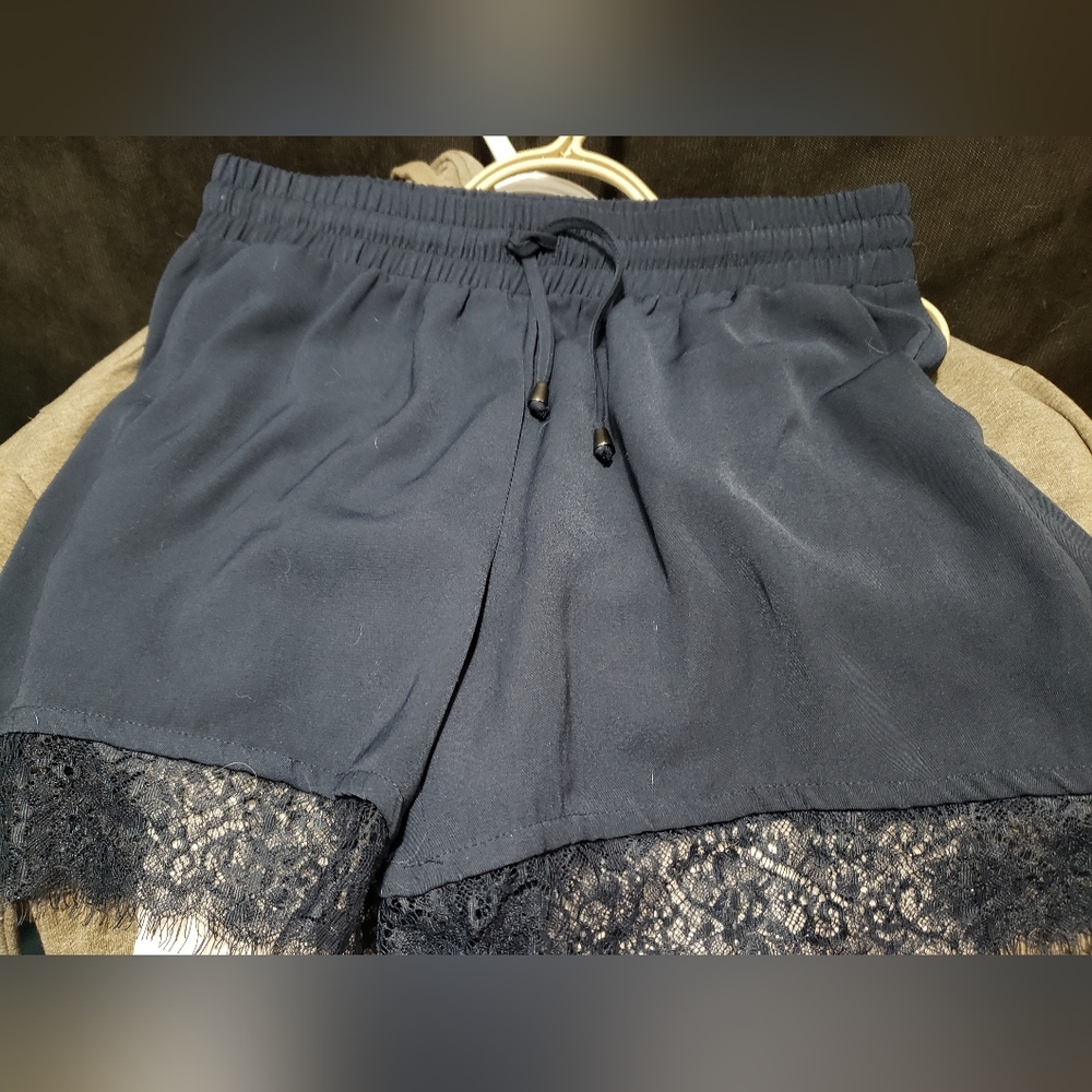 Only shorts. European sizing so size 40 = large, navy blue